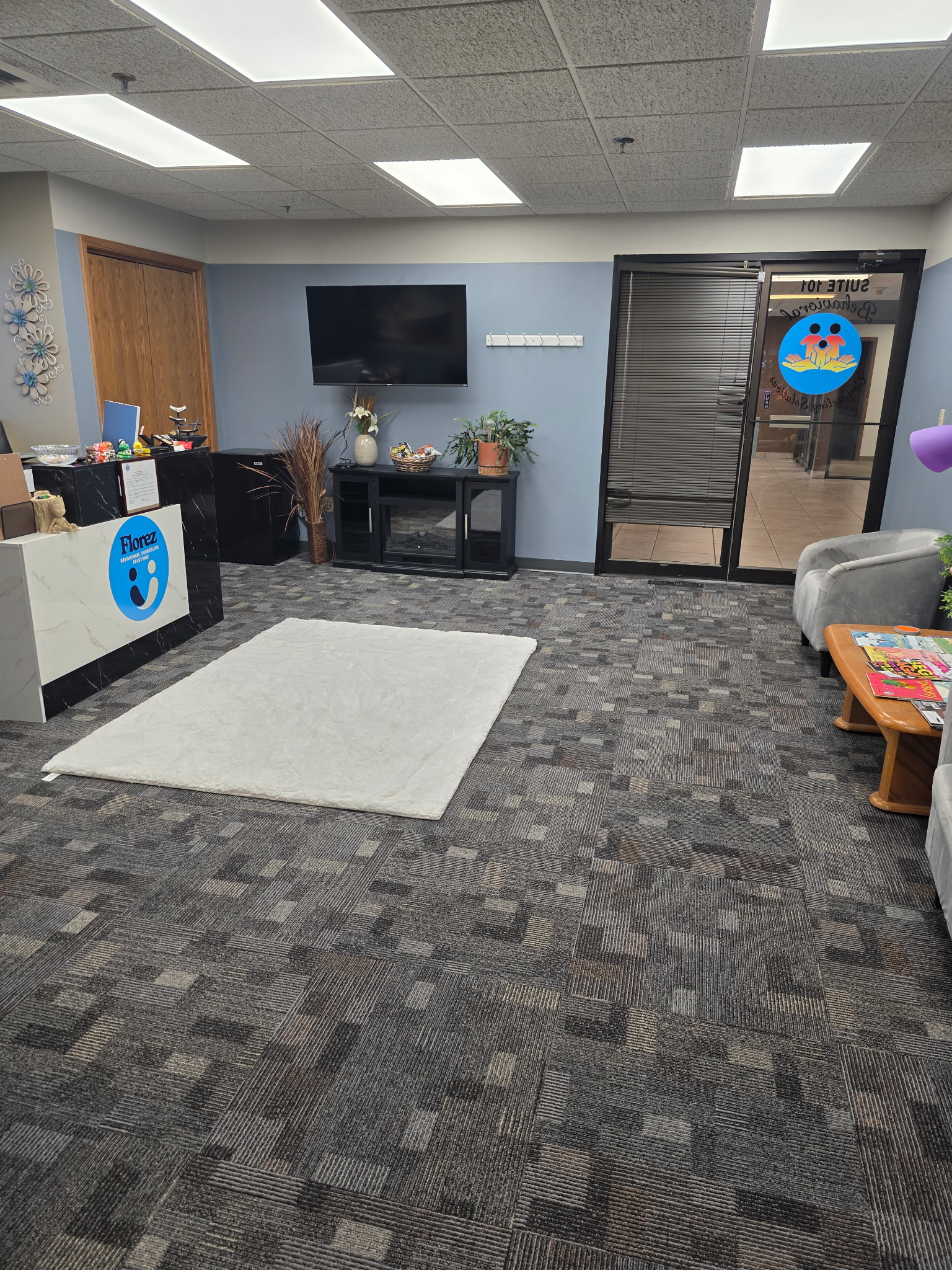 Lobby with TV, seating, and front desk